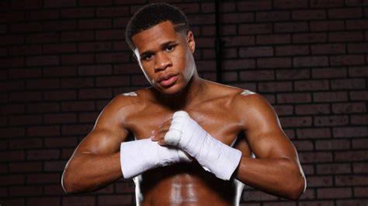 Devin Haney posing for photos with his father, Bill