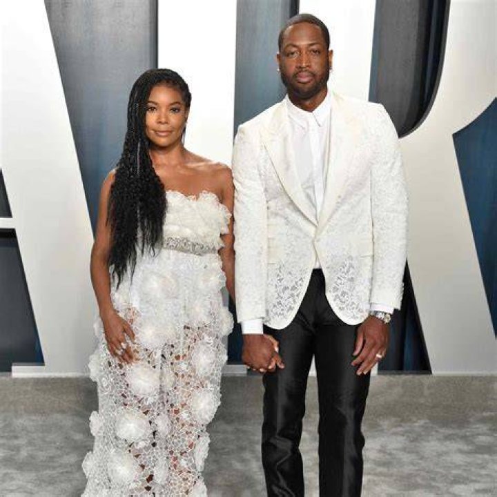Dwayne Wade And Gabrielle Union met gala 2019 black suit ball gown red carpet