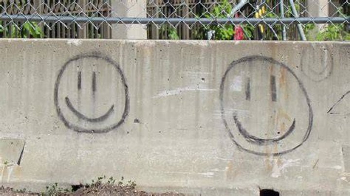 Smiley Face Killer Graffiti On A Fence